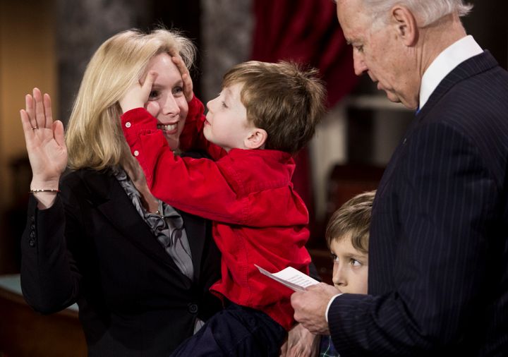 Sen. Kirsten Gillibrand (D-N.Y.) is sworn in to office in January 2013 as her son Henry messes up her hair.