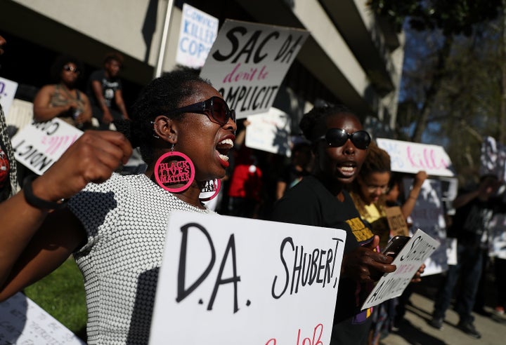 Black Lives Matter protesters stage a demonstration outside of office of District Attorney Anne Schubert on Wednesday in Sacramento.