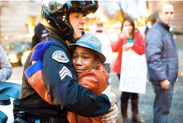 The viral moment when Devonte Hart and a police officer hugged at a demonstration.