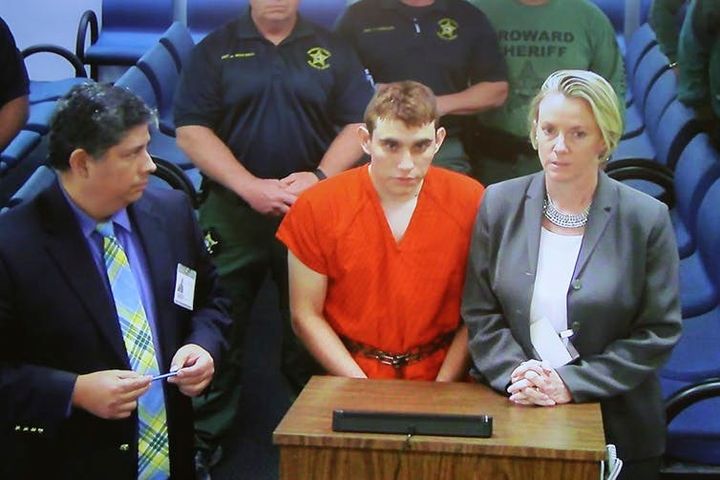 Parkland, Florida school shooting suspect Nikolas Cruz, center, makes a court appearance.