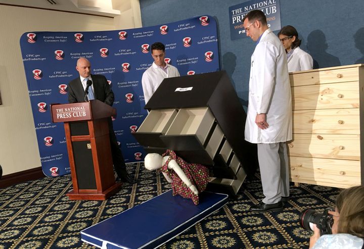 Elliot Kaye (left), then chair of the U.S. Consumer Product Safety Commission, and colleagues watch as a 28-pound dummy falls under Ikea's Malm model dresser in June 2016.