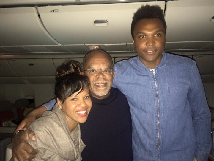 Maria V. Luna and her husband with historian Henry Louis Gates Jr. (middle) on a flight back from South Africa in 2016.