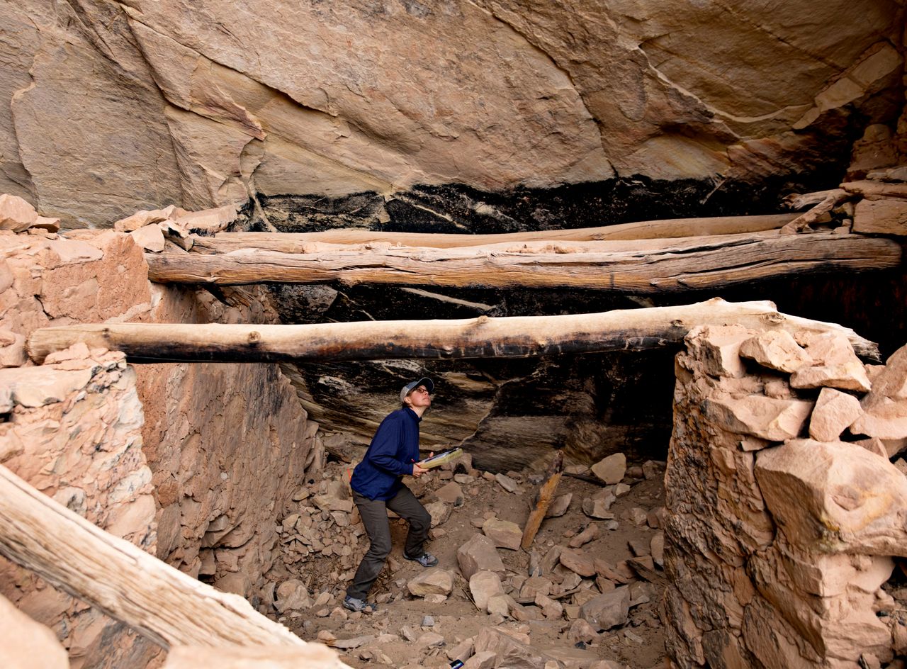 Shanna Diederichs, an architectural conservator, examines a ruin in Bears Ears National Monument and documents its condition, March 22.