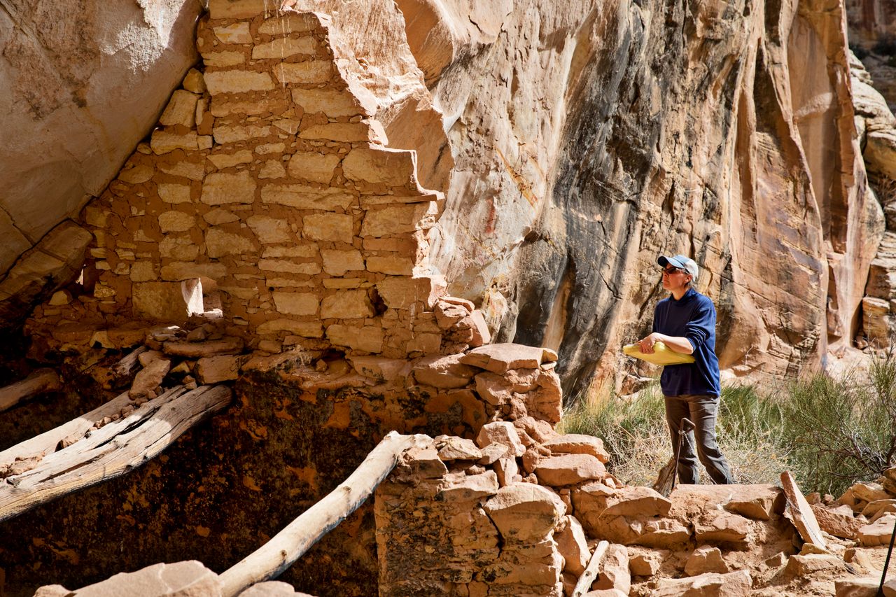 Shanna Diederichs, an architectural conservator, examines a ruin in Bears Ears National Monument and documents its condition on March 22.