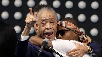 SACRAMENTO, CA - MARCH 29:  Rev. Al Sharpton, left, hugs Stevante Clark while speaking during the funeral services for police shooting victim Stephon Clark at Bayside Of South Sacramento Church March 29, 2018 in Sacramento, California. Clark, who was unarmed, was shot and killed by Sacramento Police Officers, Sunday, March 18, 2018. (Photo by Jeff Chiu-Pool/Getty Images)