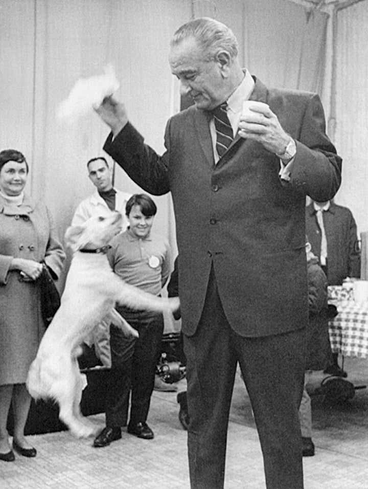 Johnson plays with terrier mix Yuki in 1968.