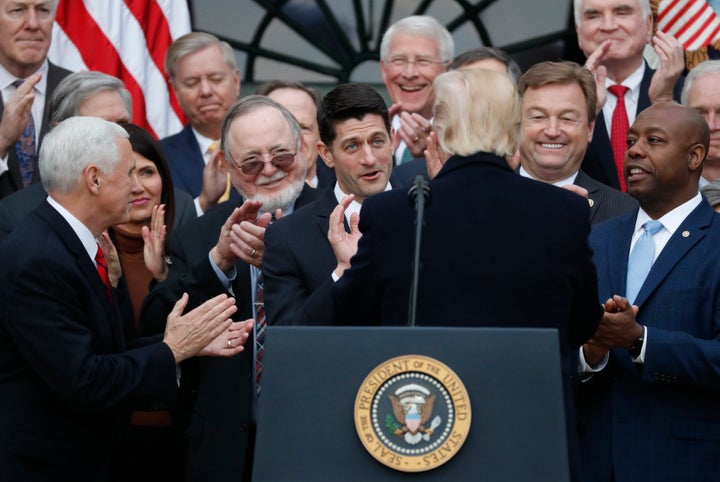 Vice President Mike Pence and House Speaker Paul Ryan (R-Wis.) applaud U.S. President Donald Trump after passing sweeping tax overhaul legislation on Dec. 20, 2017. 