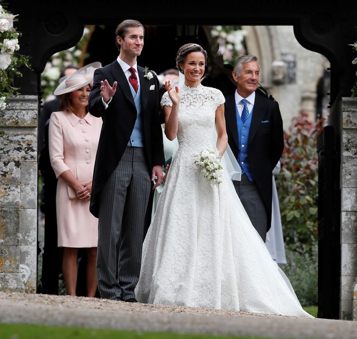 James Matthews poses last spring with his new bride, Pippa Middleton, as James' father, David Matthews (right), looks on.