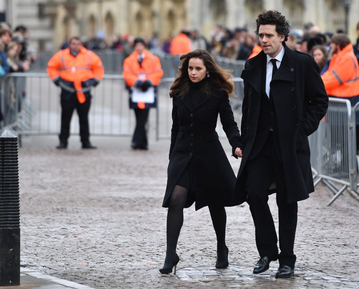 Felicity Jones, who played Hawking's first wife Jane in the film Theory Of Everything, arrives for the funeral with her partner Charles Guard