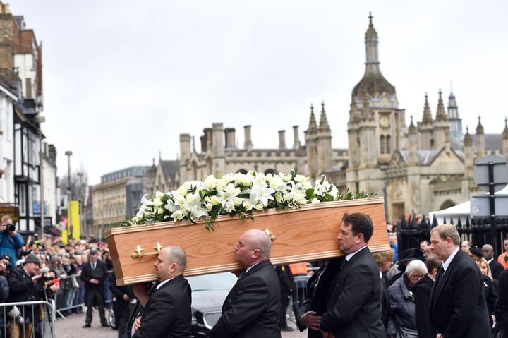 The casket containing Professor Stephen Hawking is carried into the University Church of St Mary the Great in Cambridge