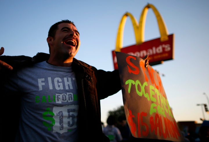 Striking McDonald's worker Abran Escarzaga, 31, protests outside McDonald's in Los Angeles, California, in December 2013.