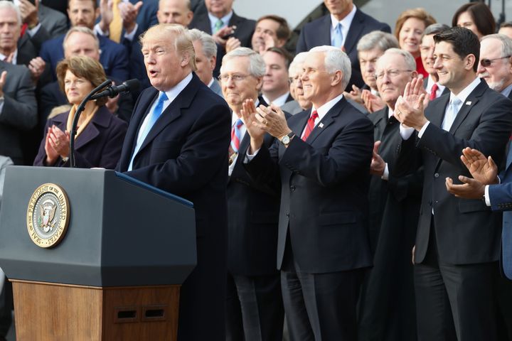 Republican lawmakers applaud president Donald Trump outside the White House, Dec. 20, 2017.