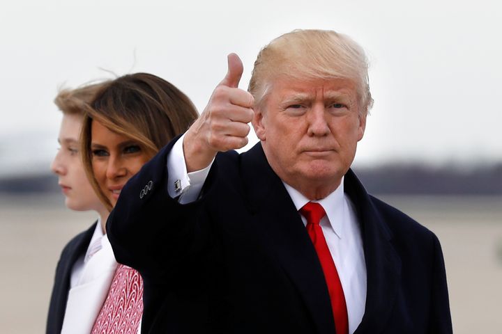 Donald Trump gestures to the media after arriving back in Maryland with first lady Melania Trump and their son Barron; the US President has said there will be no Dreamers deal