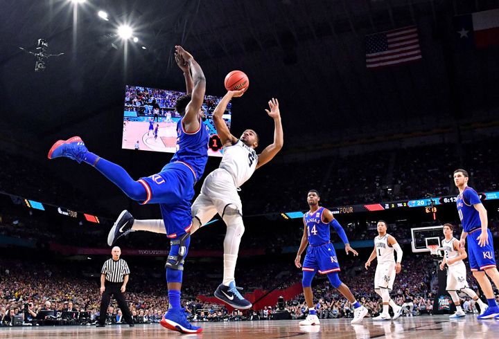 Villanova Wildcats guard Phil Booth shoots against Kansas Jayhawks center Udoka Azubuike during the first half of their Final Four matchup on Saturday. Villanova won to advance to Monday night's championship game.