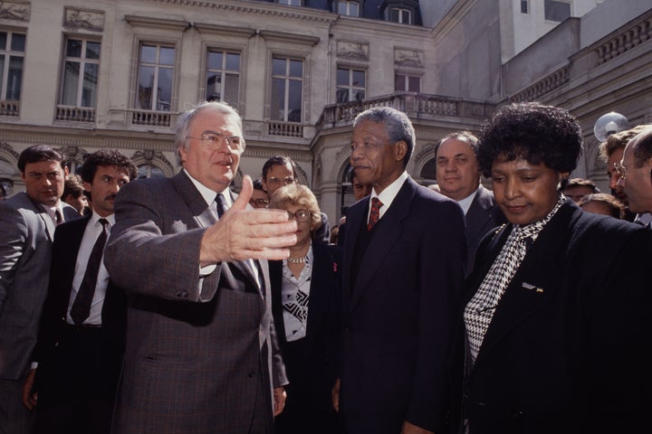 South African anti-apartheid activist and politician Nelson Mandela is seen with wife Winnie Madikizela-Mandela in the early '90s.