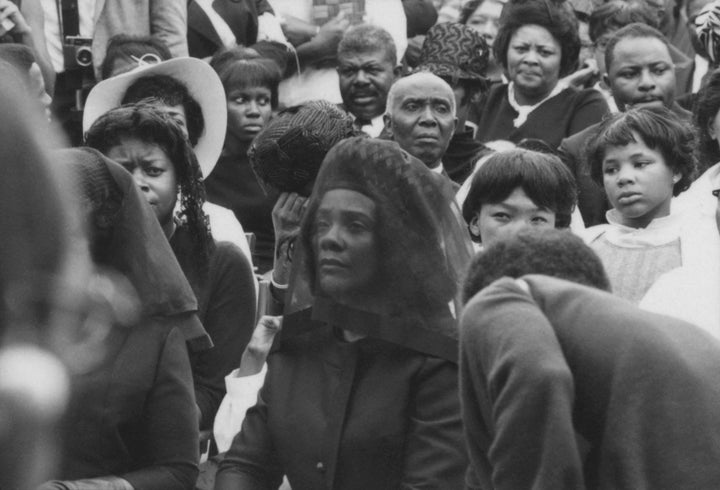 Coretta Scott King (1927 - 2006) listens to one of the speakers at the public memorial for her slain husband in Atlanta, April 9, 1968. 