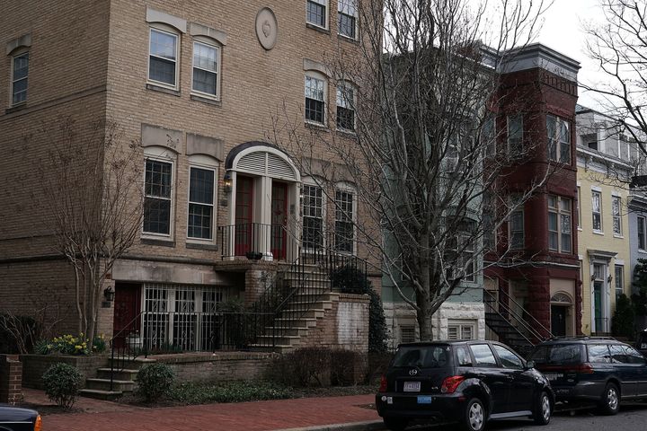 The Washington townhouse where Pruitt rents a room in a deal that has spurred criticism is pictured on the left.