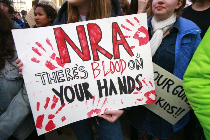 A large group of Americans and French hold a March For Our Lives rally on March 24 in Paris.