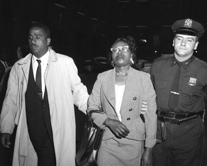Izola Ware Curry is arrested for stabbing Martin Luther King Jr. with a letter opener at a department store in Harlem while he was there for a book signing, on Sept. 20, 1958.