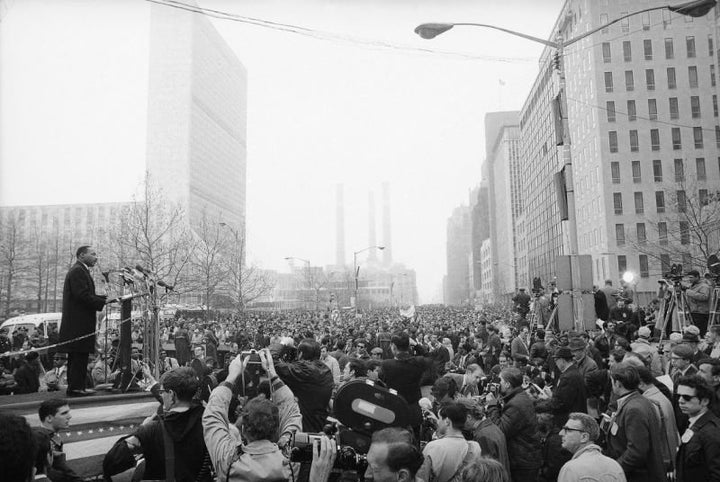 King leads a Vietnam War protest on April 15, 1967, in New York City, attracting 125,000 people, many of whom joined him in voicing a repeated demand to “stop the bombing.” 