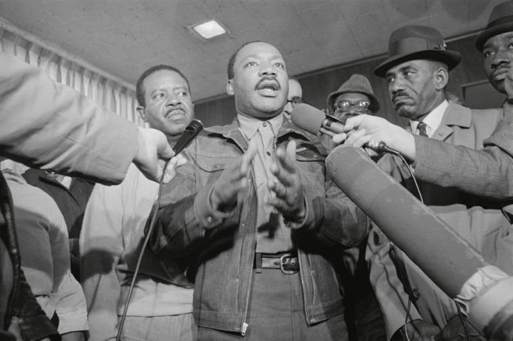 King and the Rev. Ralph Abernathy, left, are met by reporters as they emerge from the Jefferson County jail in Birmingham, Al