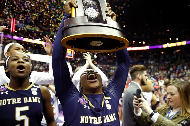 Ogunbowale holds high the NCAA championship trophy after Notre Dame defeated Mississippi State on April 1.