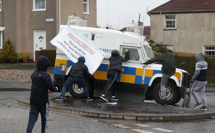Youths attack police vehicles in the the Creggan area of Derry, Northern Ireland.