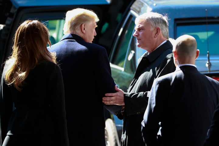 President Donald Trump speaks with Franklin Graham, right, during the funeral for his father, evangelist Billy Graham, on Mar