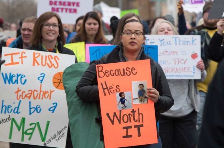 Teachers march to a protest rally at the state Capitol.
