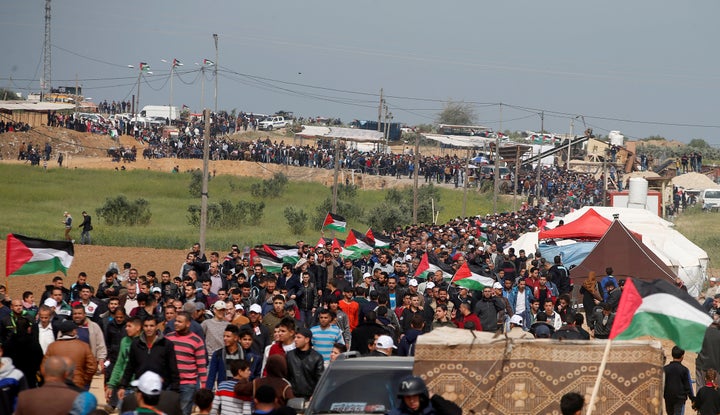 Palestinians attend a tent city protest along the Israel border with Gaza, demanding the right to return to their homeland, east of Gaza City, on Friday.