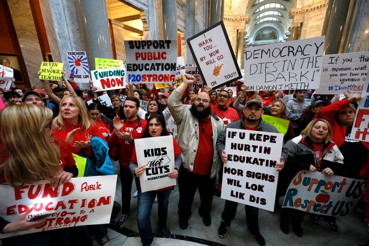 Teachers protest pension changes and potential budget cuts inside the Kentucky state Capitol on Monday.