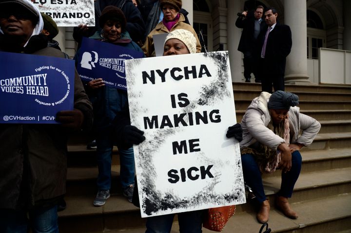Activists at City Hall protest poor living conditions and mold at NYCHA buildings in February 2017.