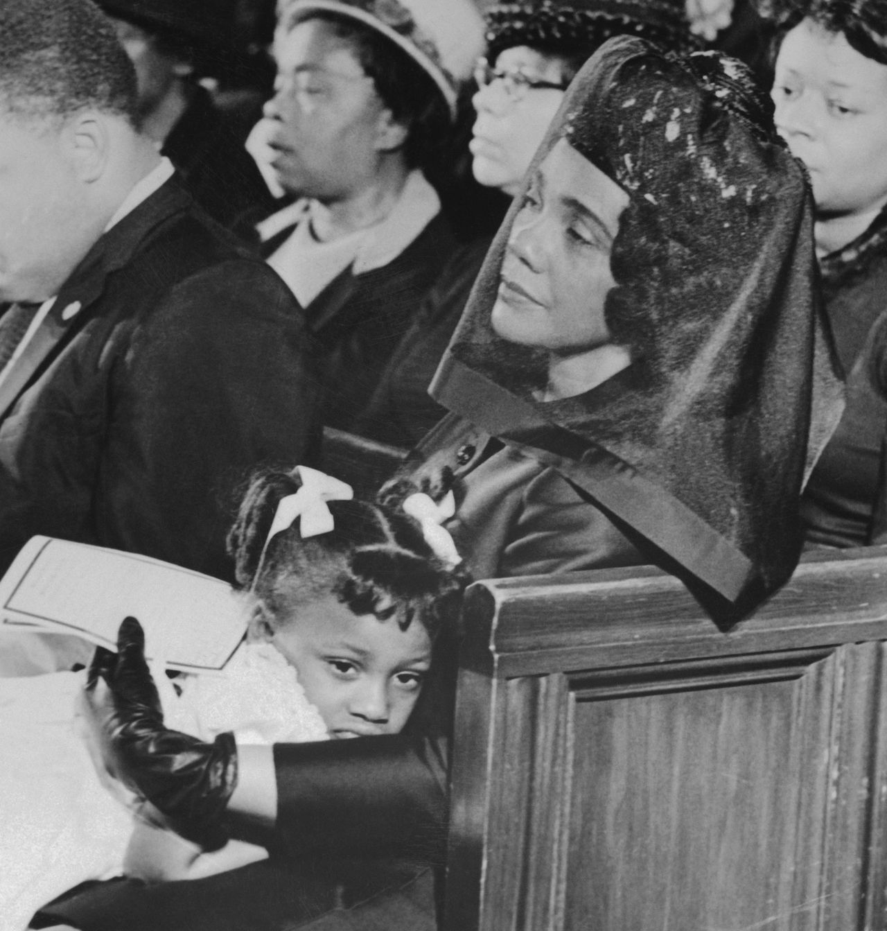 Coretta Scott King comforts her youngest daughter, 5-year-old Bernice, during the funeral service for Dr. Martin Luther King Jr. at Ebenezer Baptist Church in Atlanta.