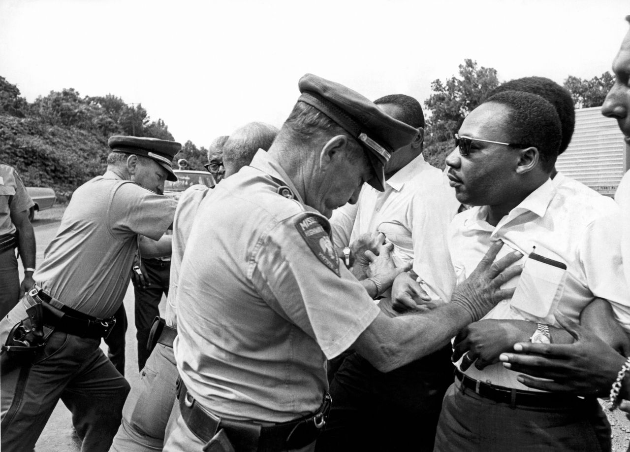 Mississippi patrolmen shove Dr. Martin Luther King Jr. during the 220-mile March Against Fear from Memphis, Tennessee, to Jackson, Mississippi, on June 8, 1966.