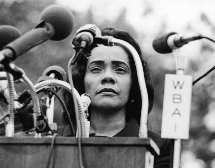 Martin Luther King's widow, Coretta Scott King, at a lectern covered in microphones during an antiwar rally in New York's Cen