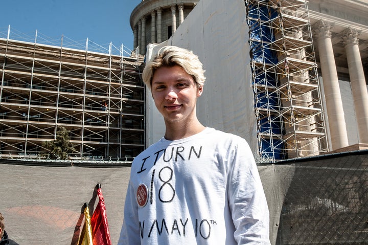 Jonathan Curtis, a senior at Edmond Memorial Highschool, stands in front of the Oklahoma state capitol on the third day of a statewide teacher walkout.