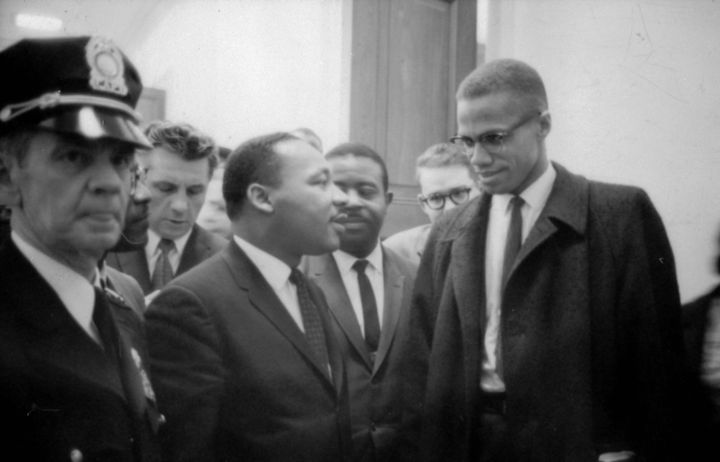 Martin Luther King Jr. and Malcolm X waiting for a press conference on March 26, 1964.