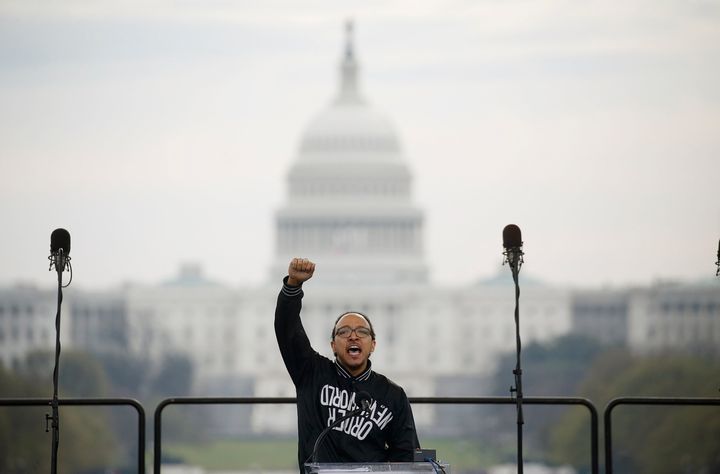 Christian hip-hop artist Julian “J.Kwest” DeShazier speaks to anti-racism marchers as they gather at the National Mall.