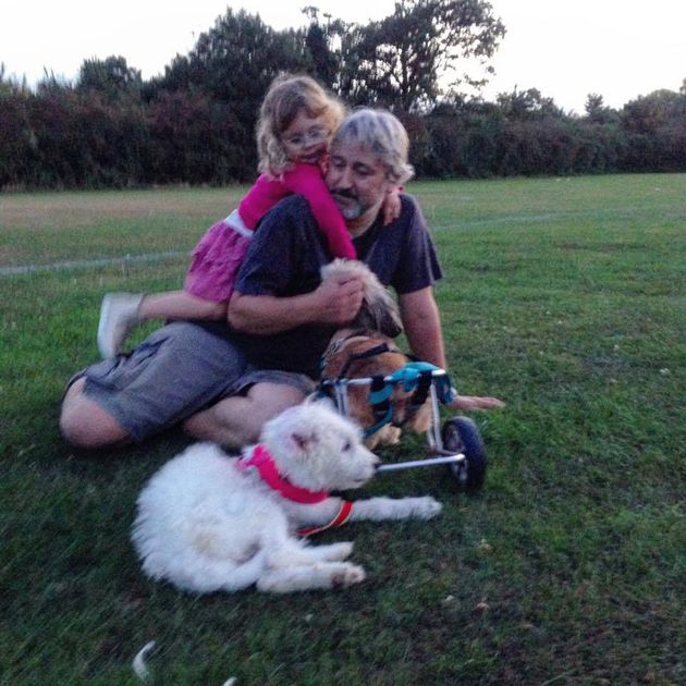 Tim and daughter Lily with their two dogs. 