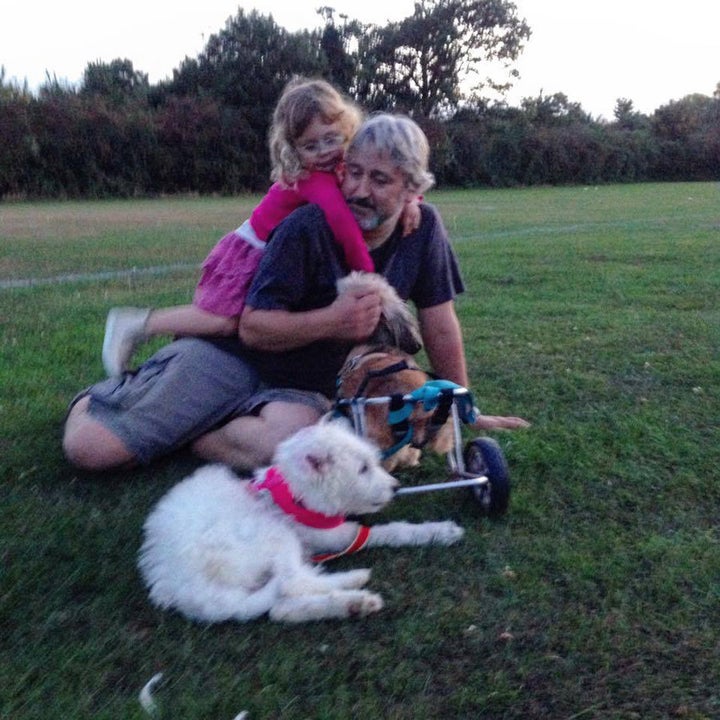 Tim and daughter Lily with their two dogs. 