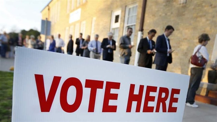 Voters line up to cast their ballots in Fort Worth, Texas. State felon voting laws vary widely, which can create confusion. R