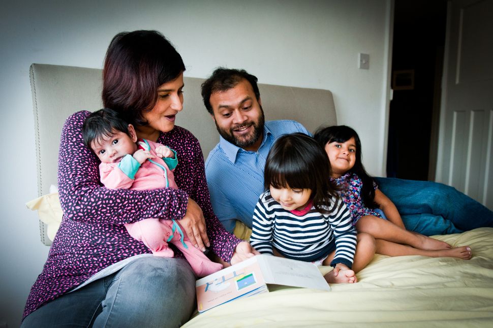 Yasmin Husain with her husband and their three kids, Ariana, four, Sabine, two, and Aydan, six months, who sometimes keep them up all night.