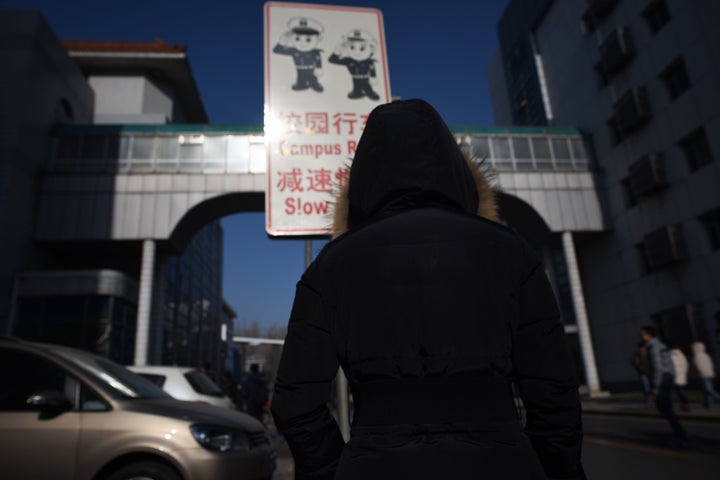 A woman walking at Beihang University in Beijing in January 2018. The university had recently stripped a professor of his position as vice director of the graduate school after an investigation established he had sexually harassed multiple students.