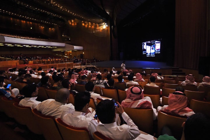 Saudi Arabians attend a film festival at King Fahad Culture Center in Riyadh.