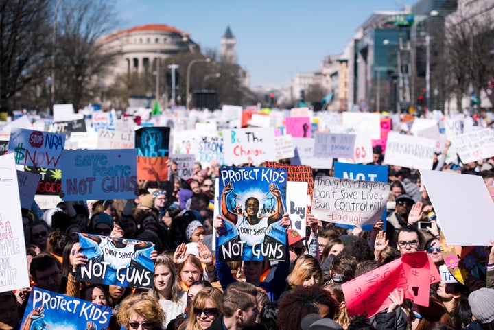 People holding signs filled blocks of Pennsylvania Avenue during March For Our Lives on March 24.