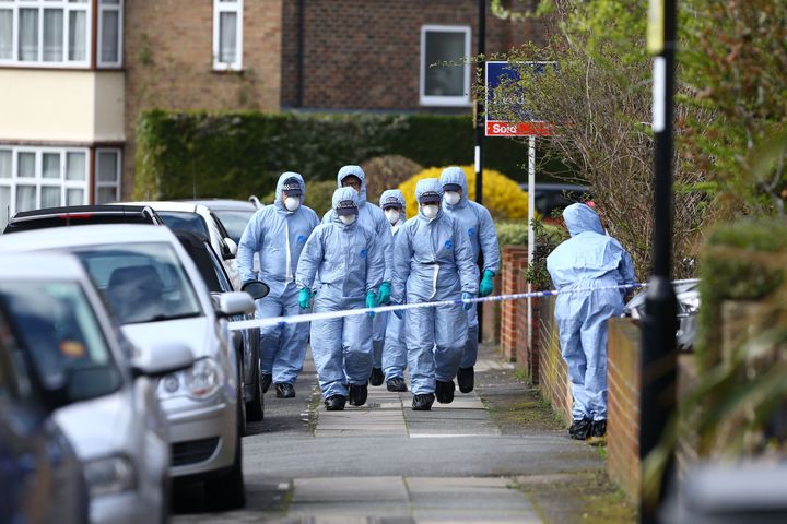Forensic officers at the scene in South Park Crescent in Hither Green, London.