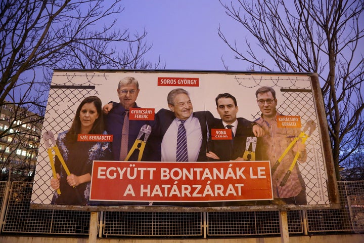 A Fidesz party billboard depicts Hungarian-American George Soros and members of the opposition holding wire cutters arou