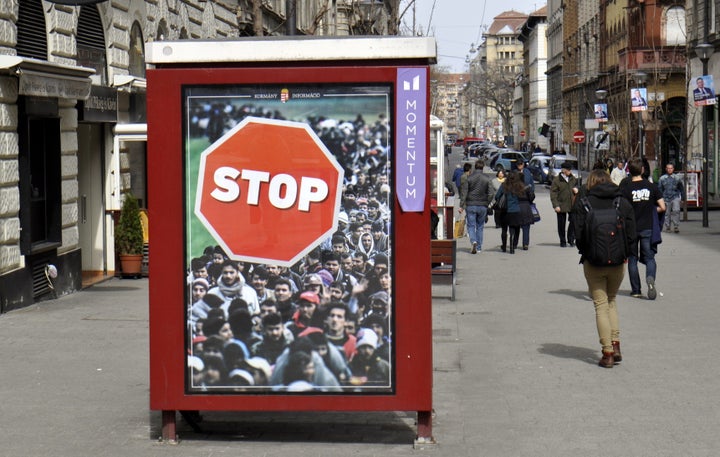 Anti-refugee election posters like this one, spotted on April 4, 2018, appeared ahead of a parliamentary election in Bud