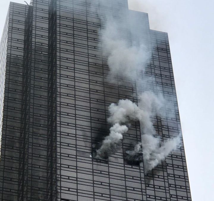 Smoke rises from the 50th floor of Trump Tower in New York on April 7, 2018. 