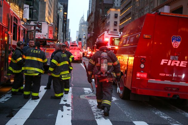 First responders work on a fire in a residential unit at Trump tower in the Manhattan borough of New York City on Saturday evening.